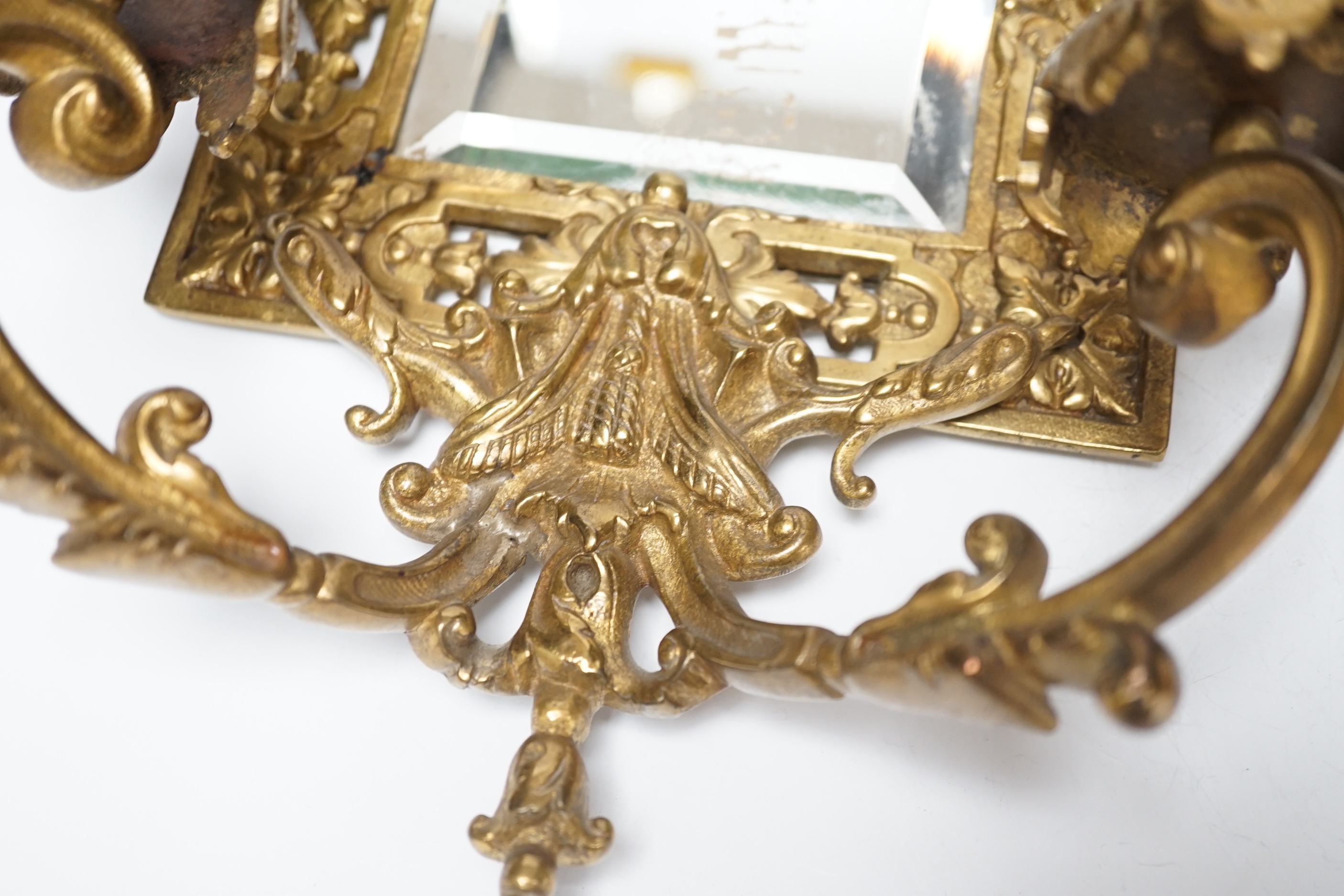 A pair of period-style mirrored brass girandoles, 61cm high